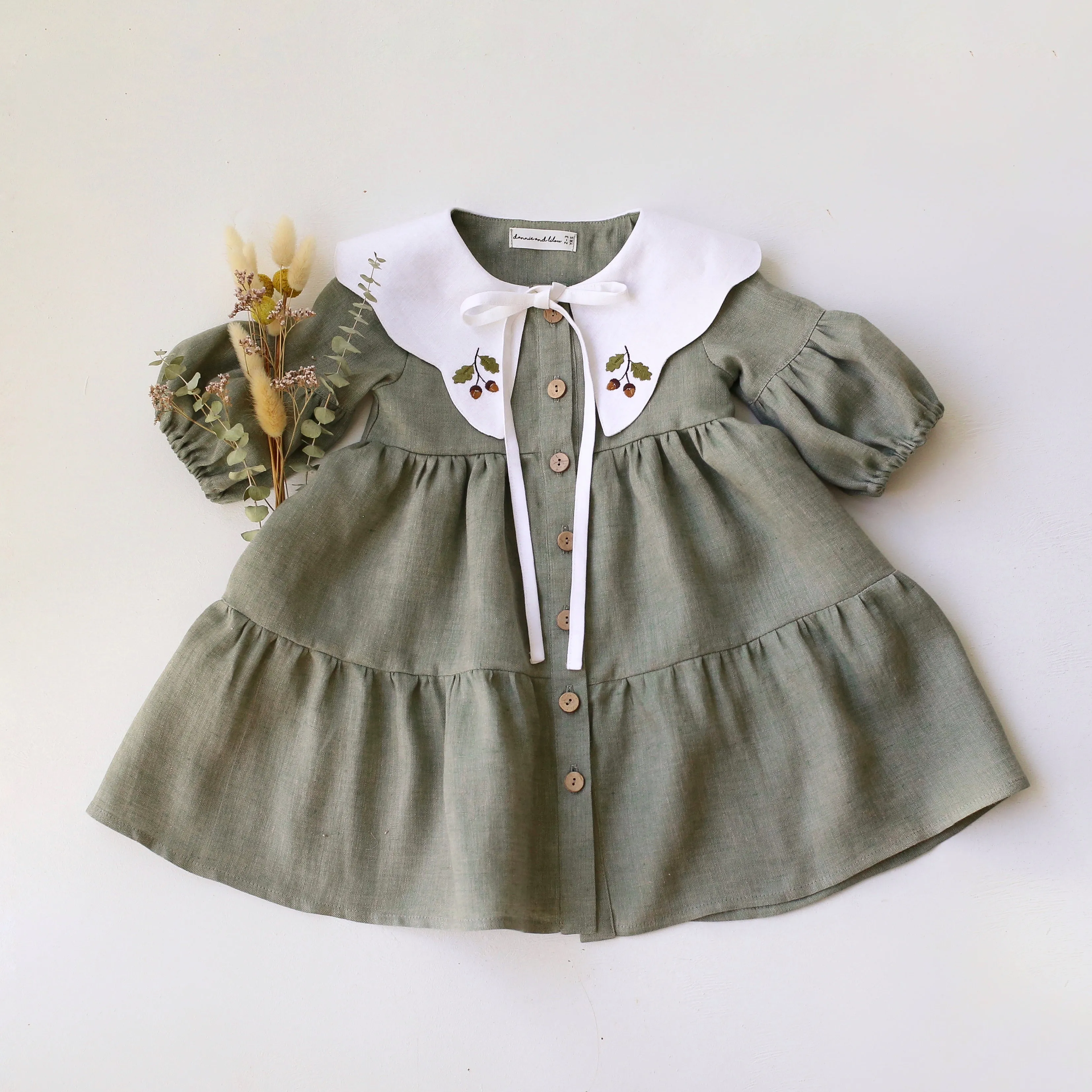 Green Smoke Linen Lantern Sleeve Tiered Dress with Scalloped Collar in White Linen with "Mini Acorns" Embroidery