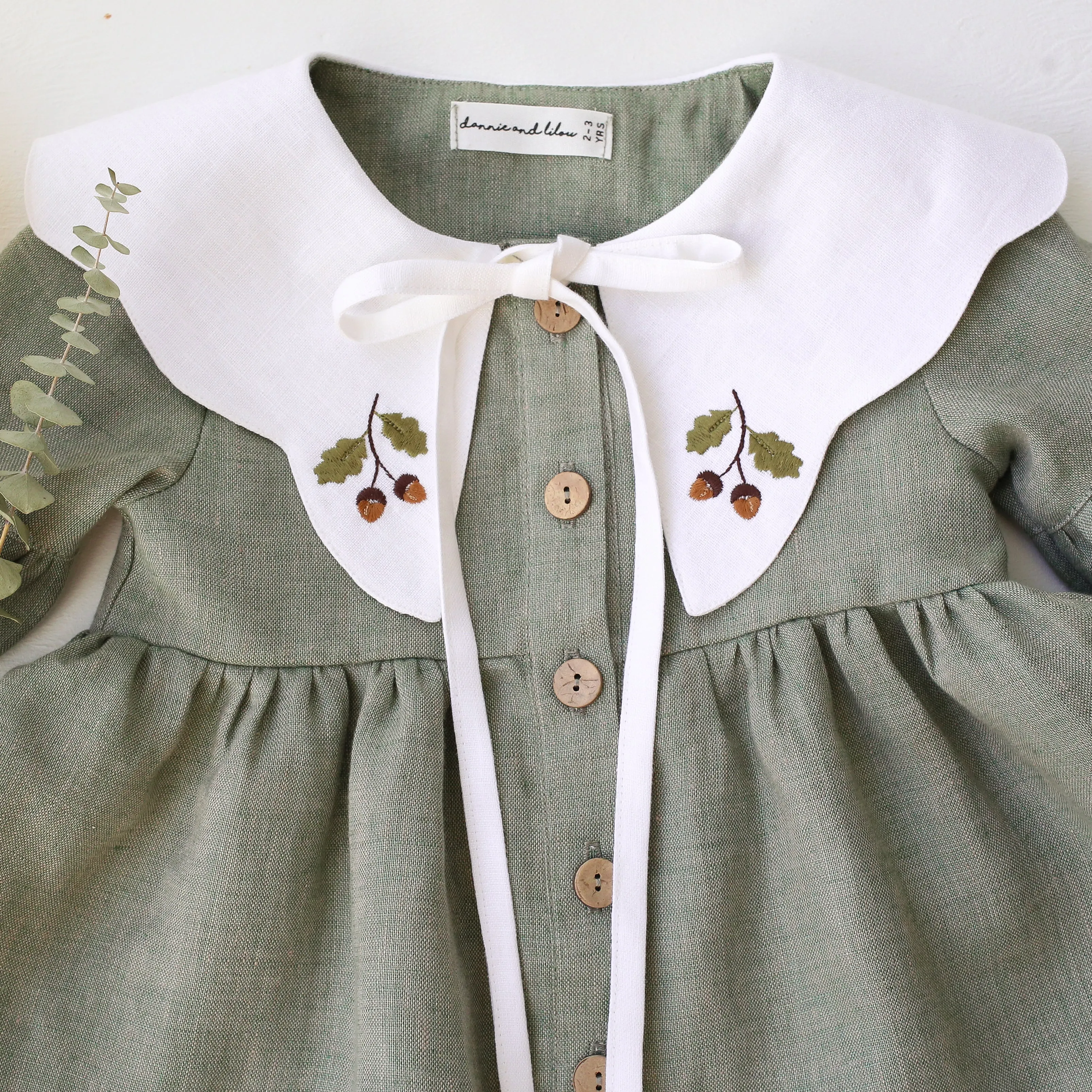 Green Smoke Linen Lantern Sleeve Tiered Dress with Scalloped Collar in White Linen with "Mini Acorns" Embroidery